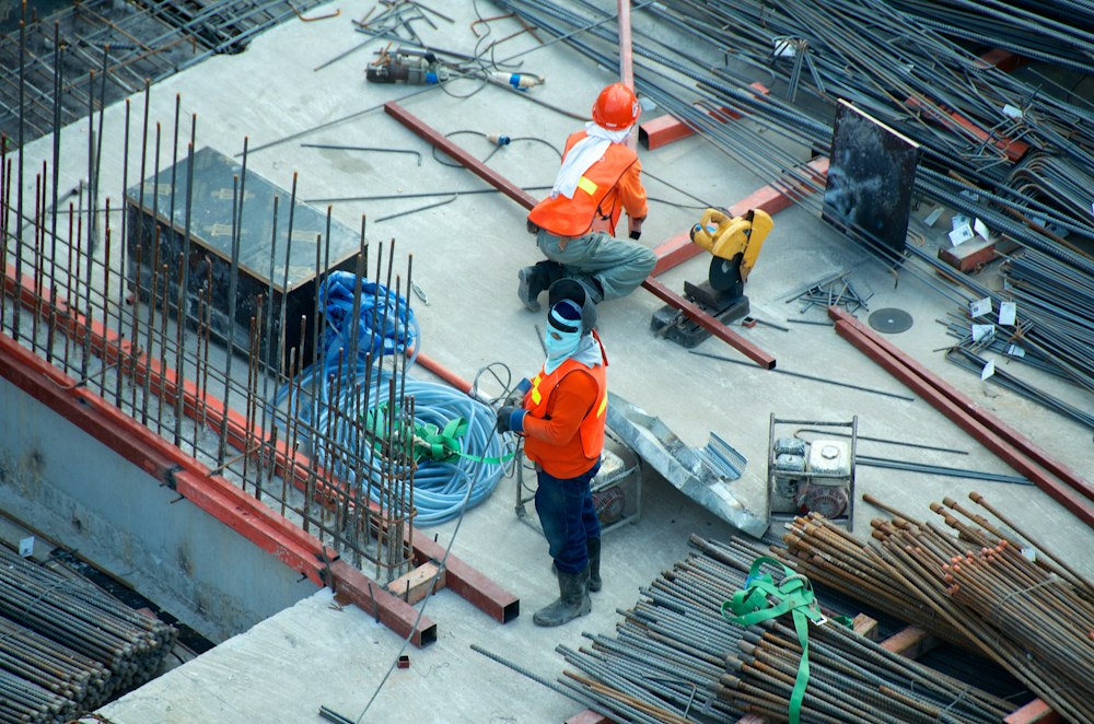 Construction workers and building materials at a project site